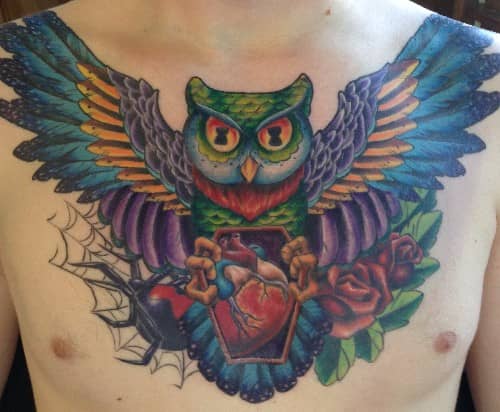 tattoo by Starr, colorful owl chest piece